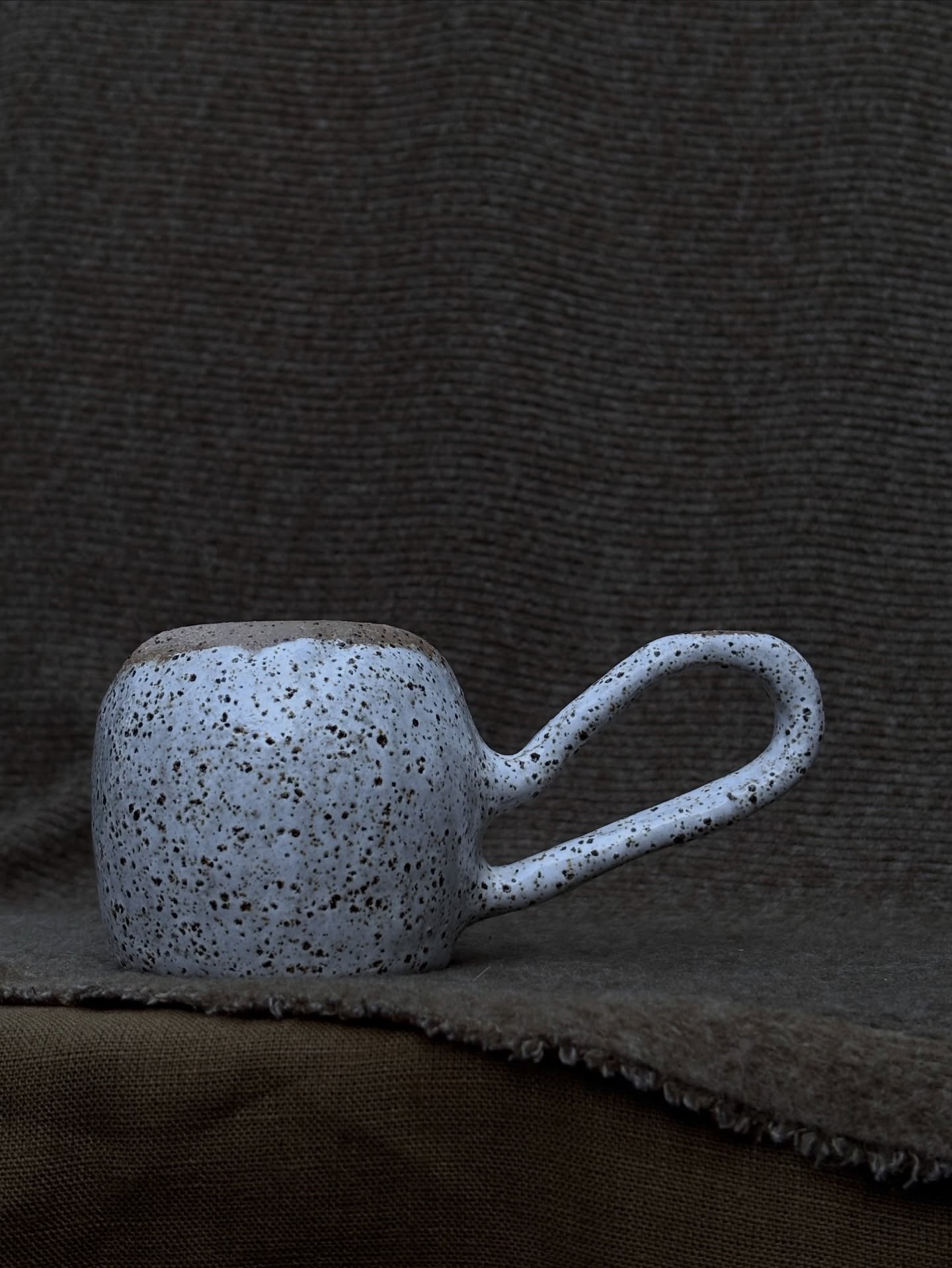 Speckled handbuilt mug with looped handle